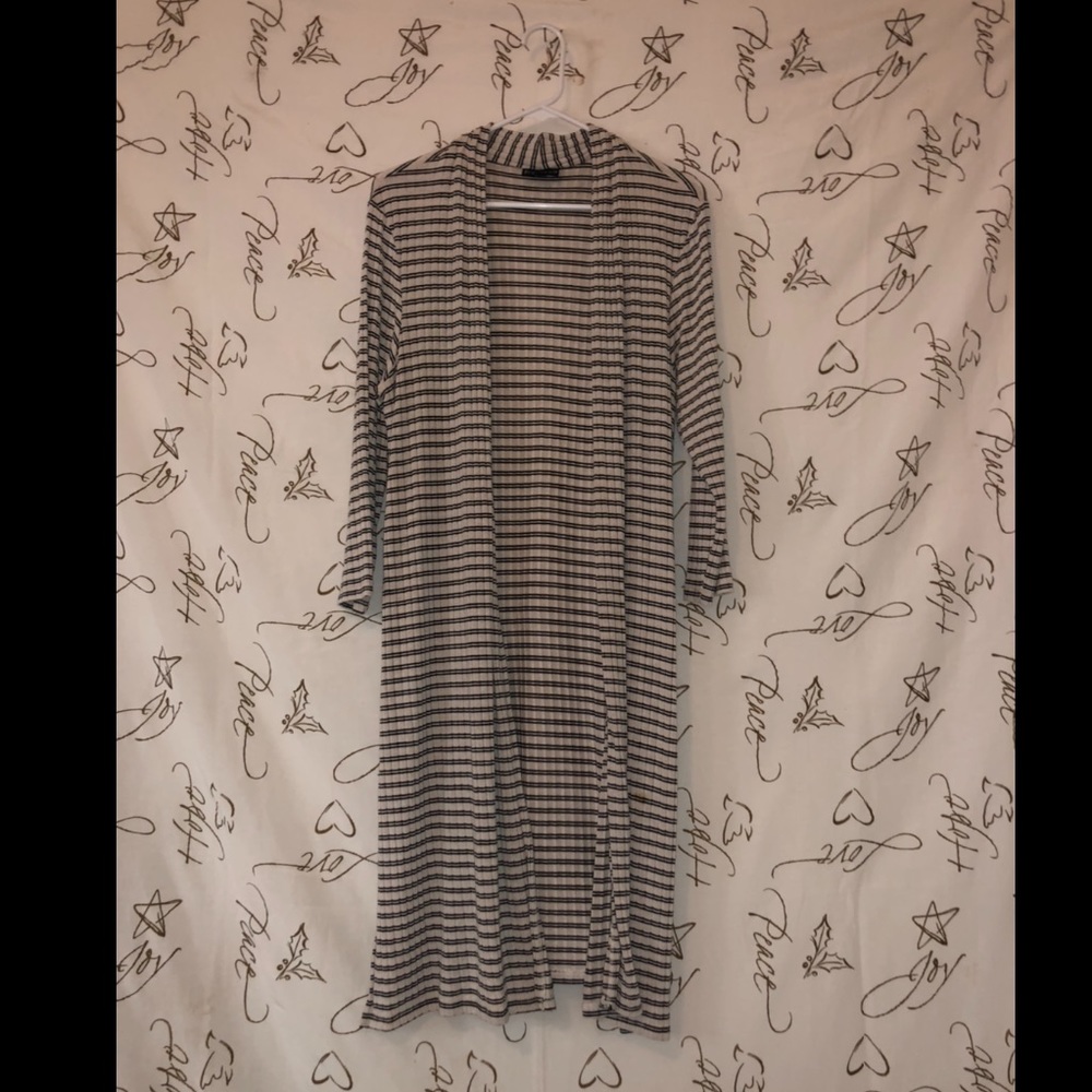 A cardigan being sold for $7.00